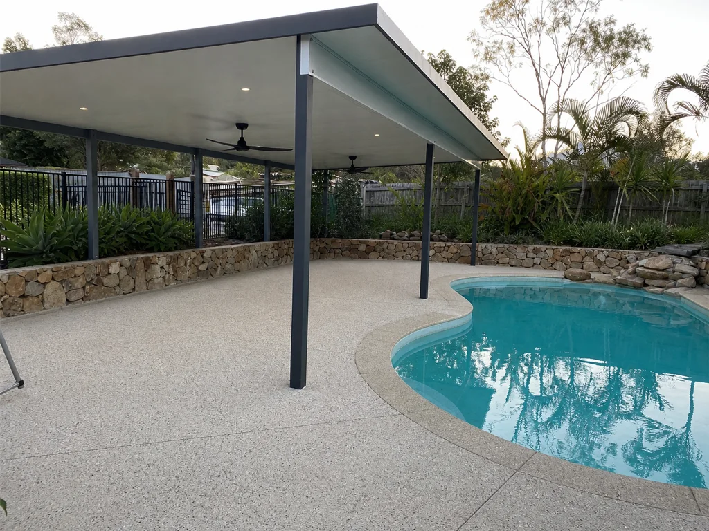 Exposed aggregate poolside patio and alfresco area
