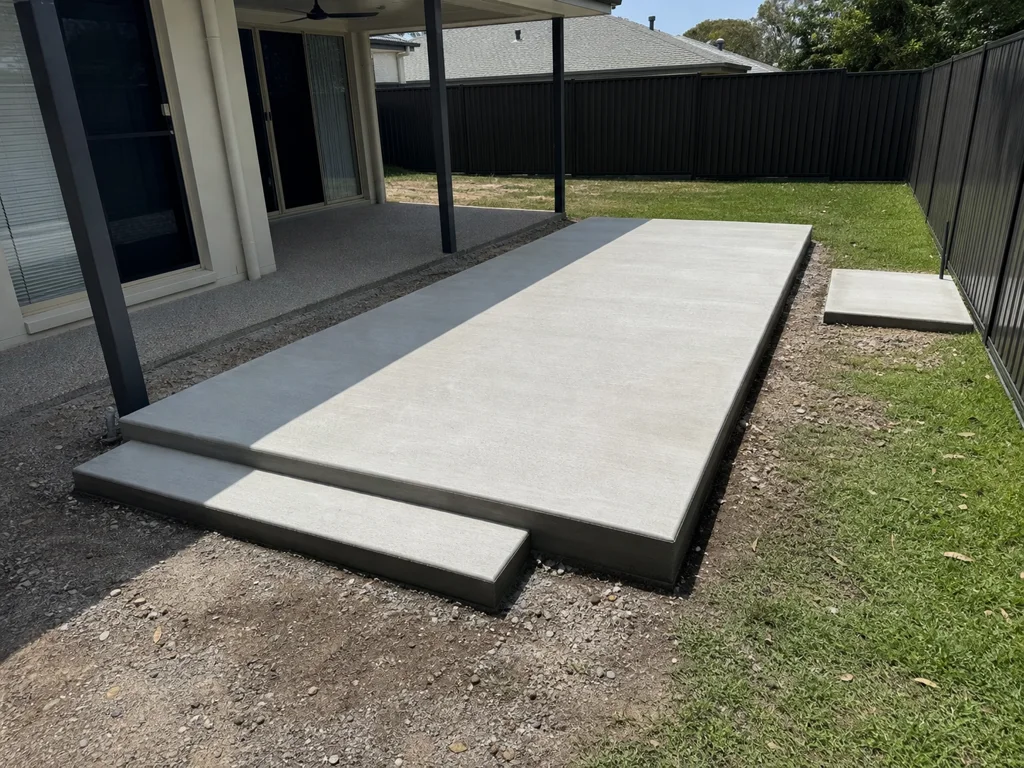 Custom concrete swim-spa slab and access step